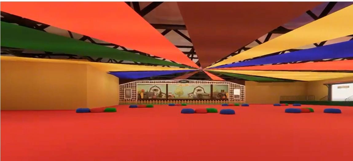 Interior do tatersal decorado com tecido colorido e espaço para crianças
