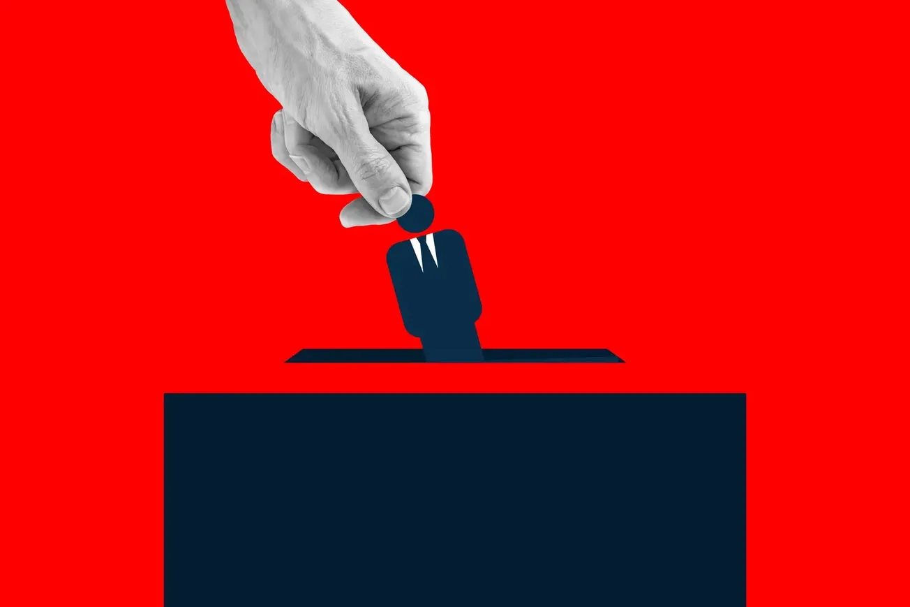 Ilustração de mão colocando figura humana estilizada em urna de votação sobre fundo vermelho
